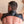 Load image into Gallery viewer, A shirtless man with grey hair wearing the Brigade Harness and standing in front of a beige wall is shown from behind. The harness covers the tops of his shoulders and a small portion of his upper back and has straps that loop under his arms.
