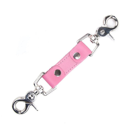The pink Premium Garment Leather Restraint Clip on a white background. It is a short piece of black leather with silver metal rivets and a metal snap hook on each end.