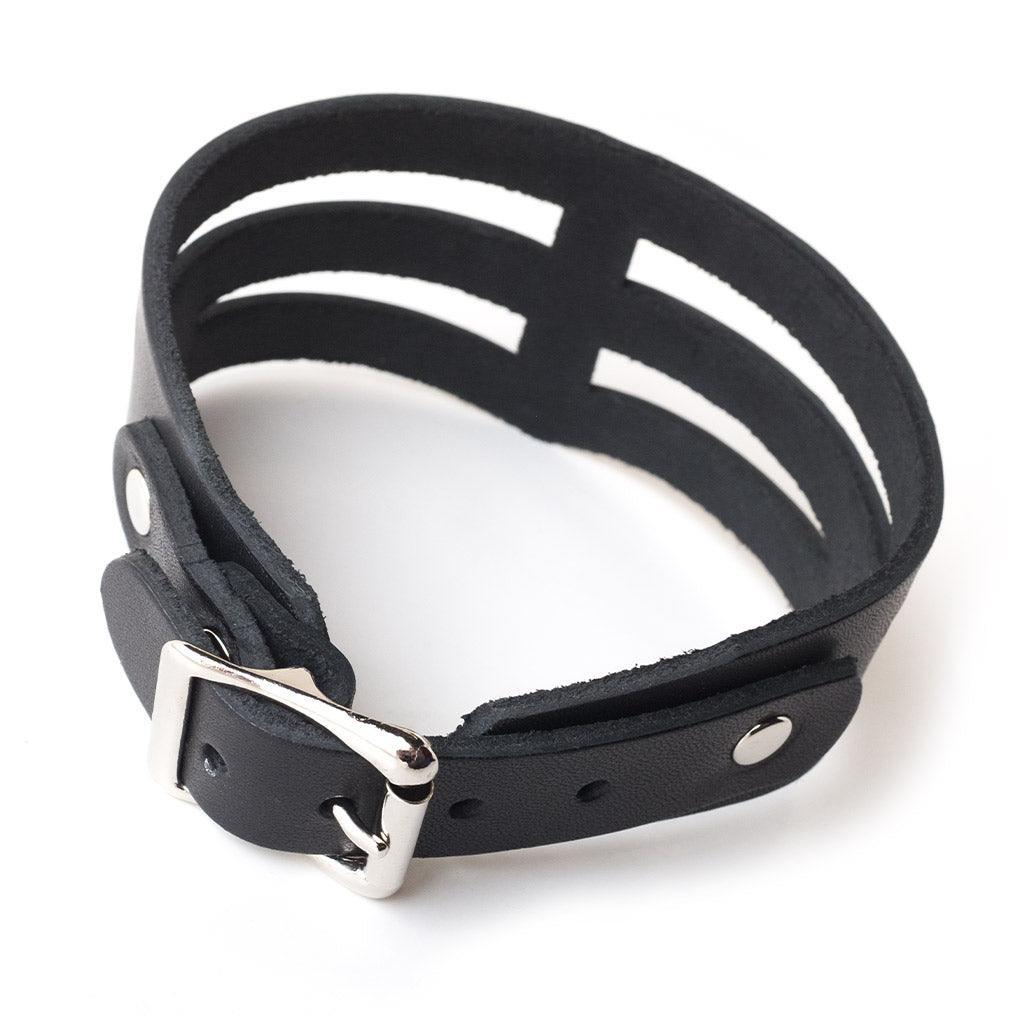 The leather STK Lux “Dom” Collar is shown from the back against a blank background. It has a silver metal buckle.