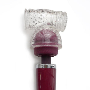 The Kinklab Viberite® Hammerhead Masturbator Attachment is shown placed over a red wand vibrator against a blank background. The attachment is clear and has an internally textured cylinder that rests on top of the head of the wand.