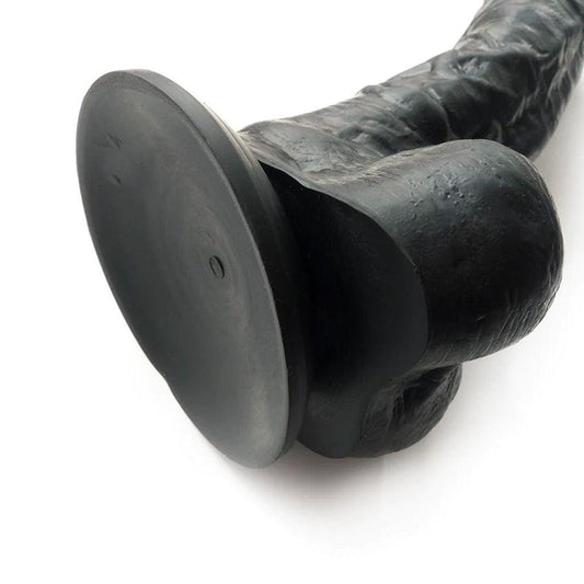 A closeup of the suction base of the Colours 8" Silicone Black Dildo is shown against a blank background.