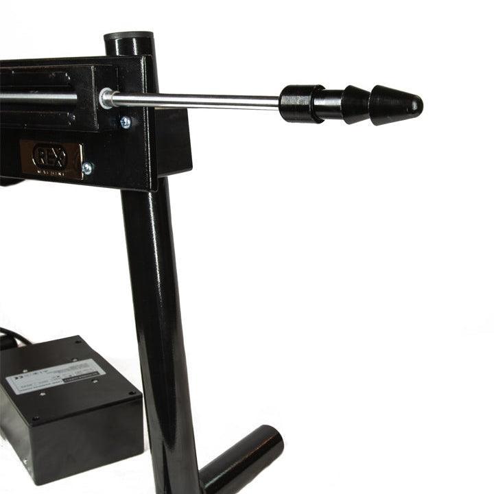 A close-up of The Rex Machine is displayed against a blank background. The close-up shows the rod with a Vac-U-Lock adaptor at the end.