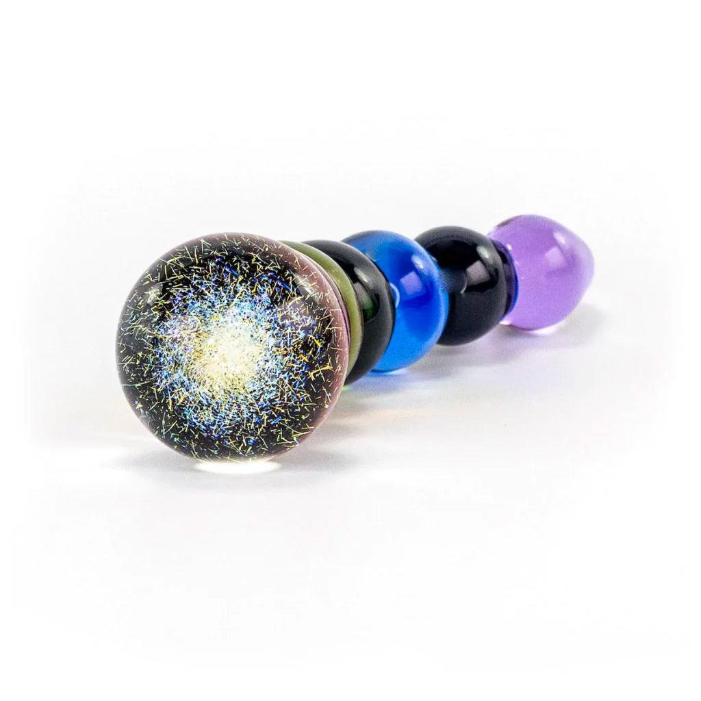 The Dichroic Bulb of the Rainbow Bubble Glass Dildo is shown against a blank background. The bulb appears to be black with tiny fleck of color scattered throughout.