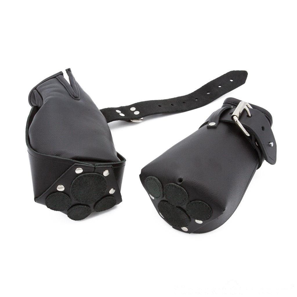 A product shot of the Leather Puppy Paw Mitts made by The Stockroom on a plain white background. These bondage mittens are intended for animal roleplay and pet play.