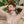 Load image into Gallery viewer, A nude woman wearing the Vondage Silicone Ball Gag is shown from the chest upwards sitting against various beige pillows. Her lips are bright red, and her eyes are closed. Her hands have gathered her red hair on top of her head.
