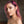 Load image into Gallery viewer, A close-up of a shirtless pink-haired woman is shown wearing the Clear CTRL Vinyl Choker. The collar is a thin band of transparent PVC with a small, dangling O-ring in the center.
