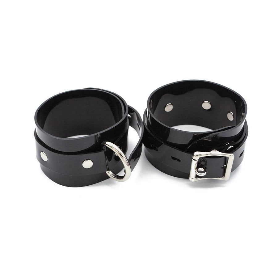 Stockroom Black PVC Ankle Cuffs are shown buckled against a blank background.