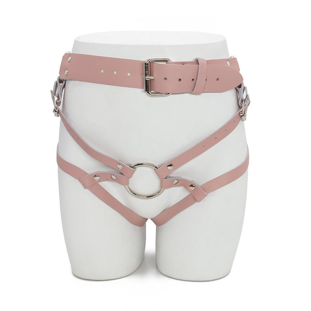 The pink leather Stockroom Stupid Cute harness is shown displayed on the lower half of a mannequin.