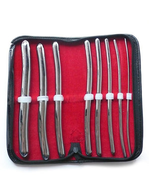 The 8 Piece Hegar Urethral Sounds kit is shown against a blank background. The case is book-shaped with a black exterior and red interior and is laid flat, displaying the sounds. The sounds are made of metal and increase in size from right to left.