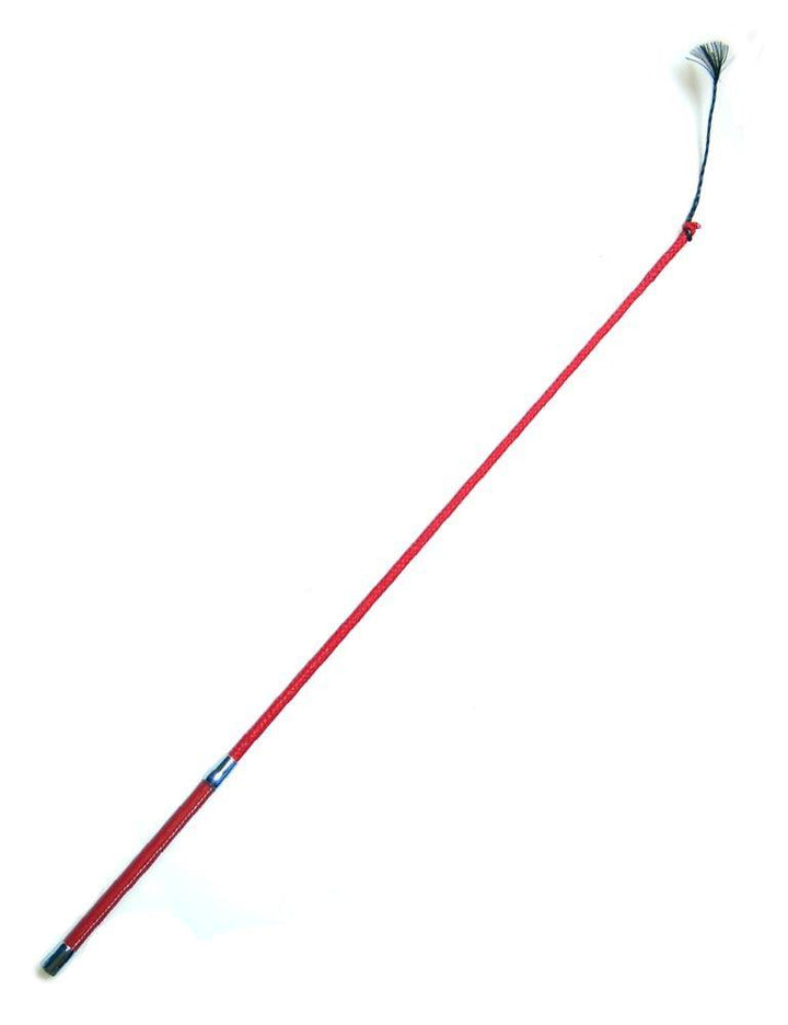 The red Flicker Whip, which has a leather-covered handle and a black nylon tassel at the end, is displayed against a blank background.