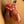 Load image into Gallery viewer, A close-up of a man’s penis is shown inside the transparent red chastity cage from the CB-3000 Complete Male Chastity Package. The cage is shaped like a flaccid penis and covers the shaft, connecting to a ring placed behind the balls, and closed with a plastic lock.
