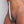 Load image into Gallery viewer, The torso of a naked woman is shown with the Steel Vaginal Hook/Hanger inserted into her vagina and held upright by a red rope tied through a loop at the end of the hook. It is stainless steel and has a sharp curve at the bottom, forming the hook
