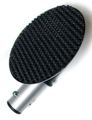 The Serving Tray Attachment For Scott Paul's Humiliator Gag, made of a round tray with a black rubber pad attached to a metal rod, is displayed against a blank background.