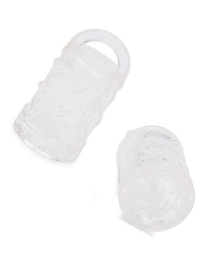 A pair of clear rubber Gripper Nipple Suction cups are displayed against a blank background. They are half-cylinder shaped and are hollow with a small loop at the top.