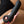 Load image into Gallery viewer, A close-up shows a woman holding the  Electrastim &quot;Ovid&quot; Silicone Noir Dildo near her vagina.
