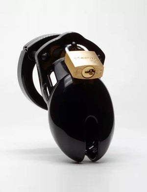 The CB-6000S Male Chastity Device in black is shown from the front against a blank background. A small, rectangular slit at the tip of the cage is visible.