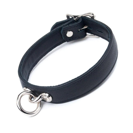 A black leather collar on a white background. It has a dangling O-ring in the front and a buckle fastener in the back.