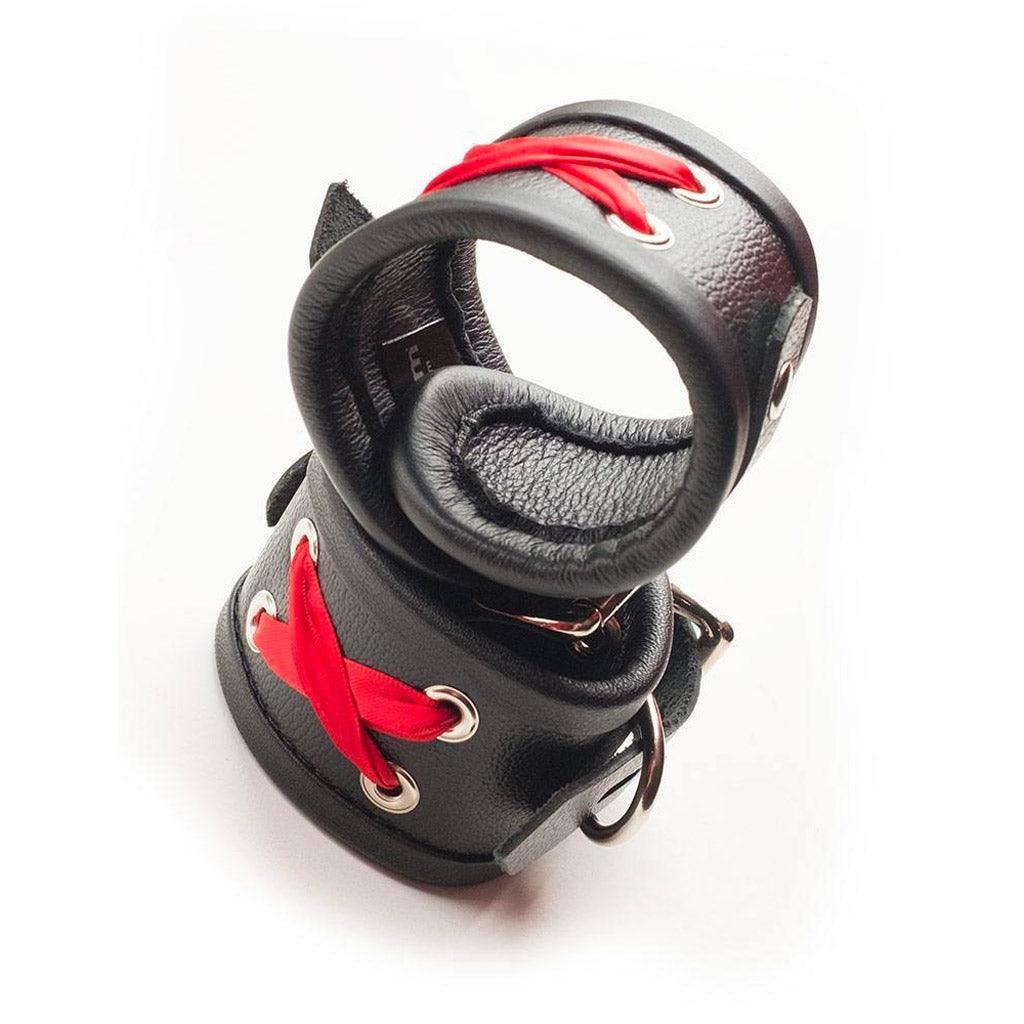 The Red Laced Leather Wrist Cuffs are shown stacked on top of each other against a blank background.