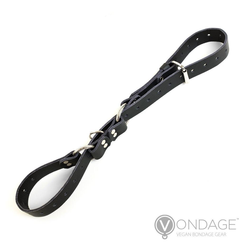 The Vondage Hobble Belt Bondage Device is shown against a blank background. The strap is woven through the D-rings on the belt in order to form two loops.