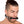 Load image into Gallery viewer,  A man with dark brown hair that is shaved on the sides and pulled into a ponytail is shown wearing the Kinklab Silicone Bit Gag against a blank background.
