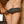 Load image into Gallery viewer, A close-up of a nude woman’s butt is shown with somebody holding the Kinklab Panamorphic Paddle 3-In-1 Spanking Set against her butt with the metal stud side facing outwards.
