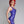 Load image into Gallery viewer, A woman with bright red hair poses in profile in front of a grey background, wearing the Latex Tank Dress by Syren Latex in purple.
