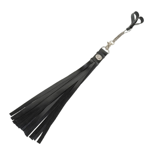 Black rubber flogger with metal details on a white background