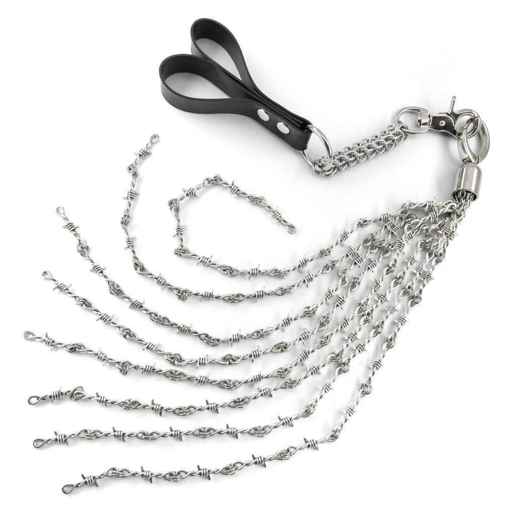The Kanuka barbed white finger flogger is shown on a white background.