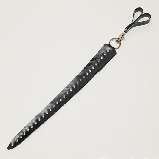 Black rubber feathered edge strap with studs on a white background