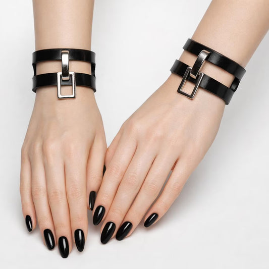 A woman's hands are shown on a white background wearing the Everly suspended day cuffs.