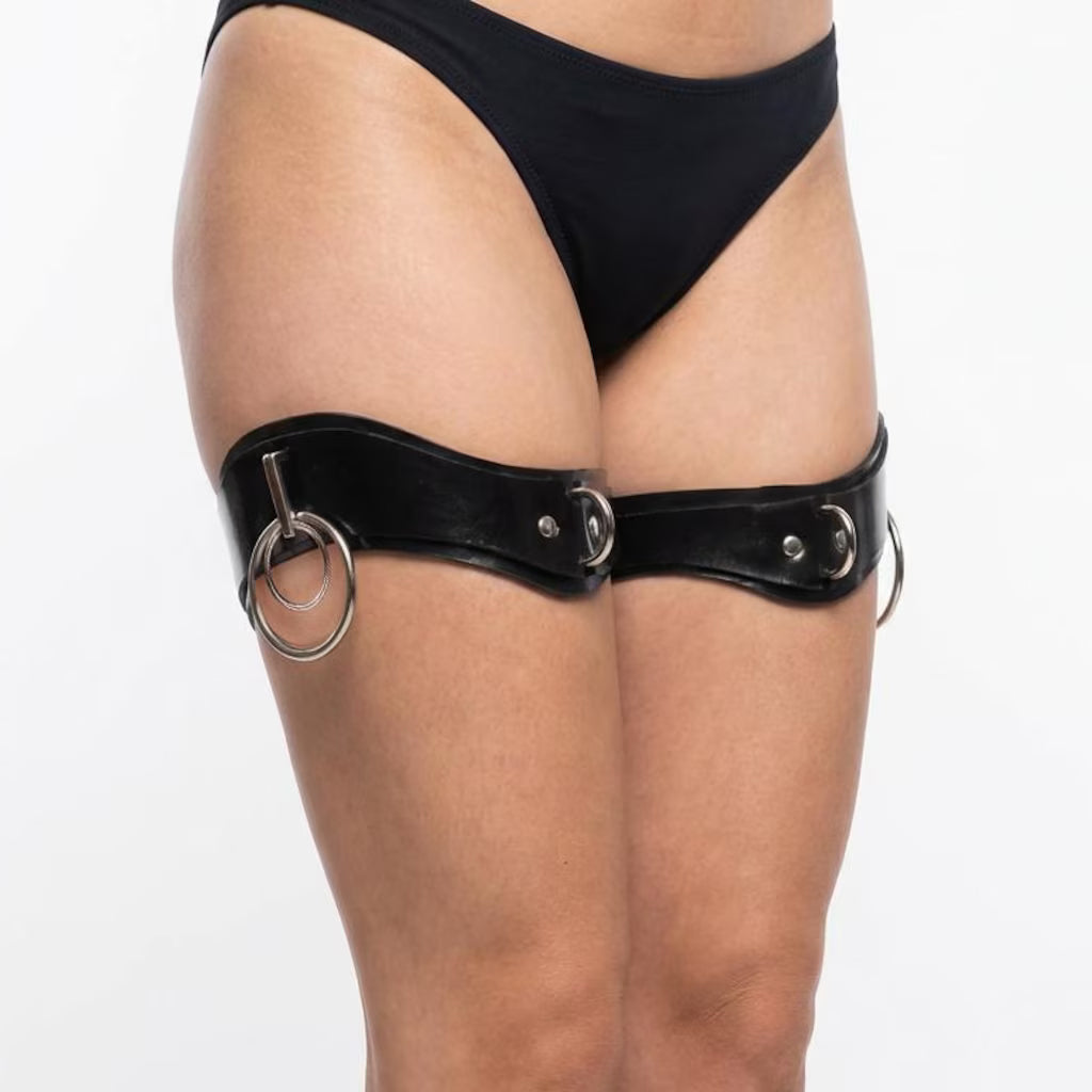 The Ilaria double ring thigh cuffs are shown on a woman on a white background