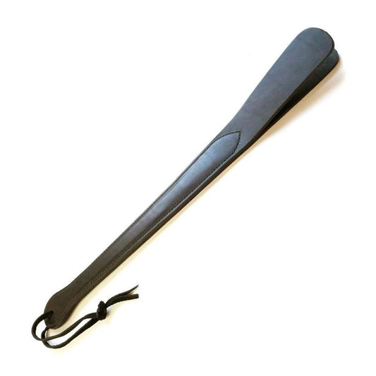 The black Leather Slapper for impact play is displayed against a blank background. It has a wrist loop at the bottom of the handle.