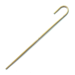 The Rattan Cane with a Crook Handle is shown against a blank background. It is a thin, pale rattan cane with a curved handle.
