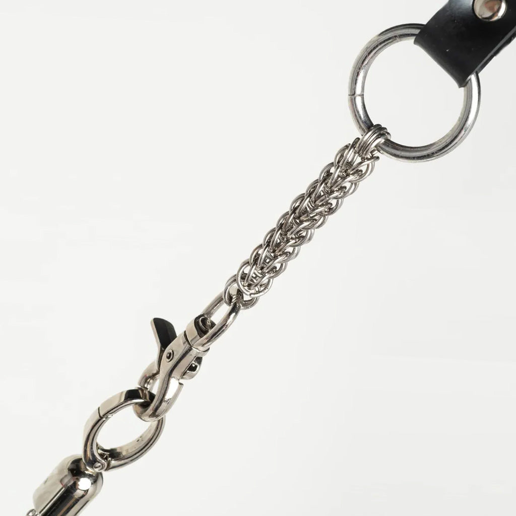 close up of attachment of silver flogger on white background. 