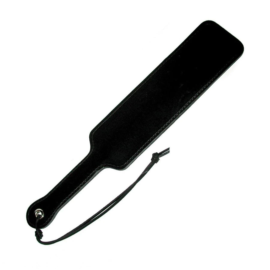 The Black Leather Fraternity Paddle is displayed against a blank background. It is rectangular-shaped with rounded corners with a wrist loop on the handle.