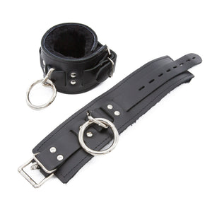 A pair of black Premium Fleece-Lined Leather Cuffs With A Locking Buckle is displayed against a blank background.