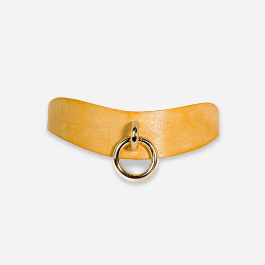 A front view of the Orbit Day Color by Neon Coyotes on a white background. The leather is a bright yellow color with gold-colored nickel hardware in the center. 