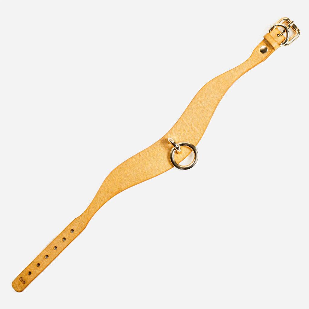 The Luxury Leather Day Collar is stretched to full length on a white background, showing the hardware on both ends. The leather is a bright golden yellow.