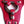 Load image into Gallery viewer, A close-up of the center of the red leather La Strap On harness, showing the two different-sized silver metal O-rings that it comes with.
