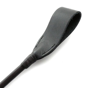 The black Flexicrop spanking implement is displayed against a blank background.