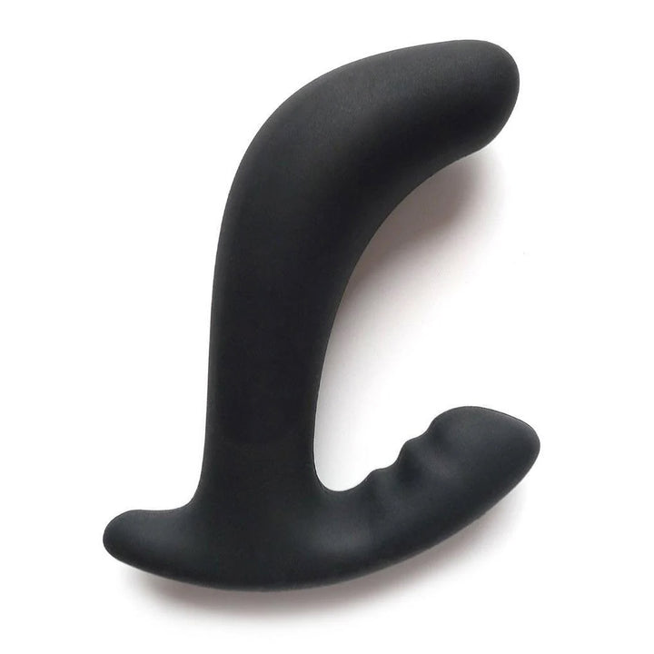The Mystim Twisting Tom is displayed against a blank background. It is a black silicone butt plug that is slightly curved with an extended base on one side for perianal stimulation.