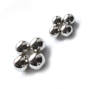 Two clusters of four magnetic nipple balls are displayed against a blank background, showing the two different sizes of balls. The magnetic balls are small silver orbs