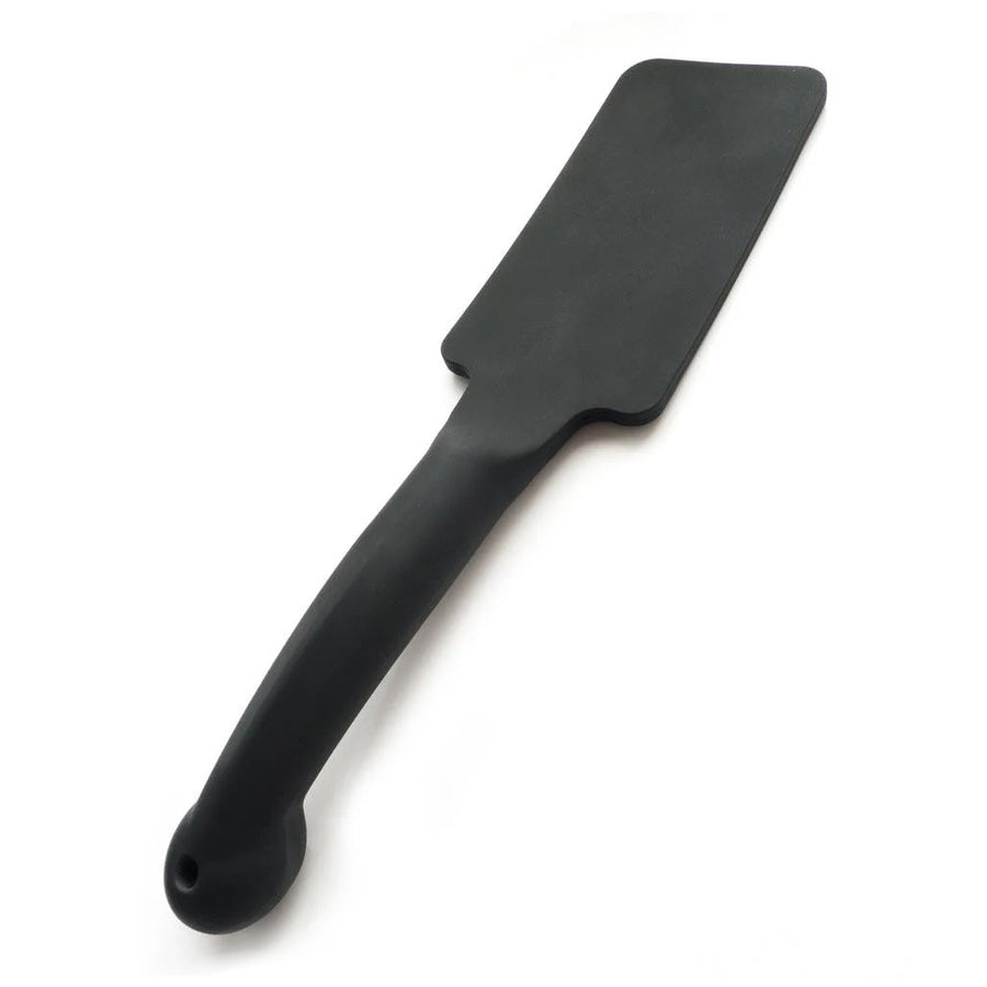 The Tantus Plunge Paddle is displayed against a blank background, showing the slight curve of the handle.