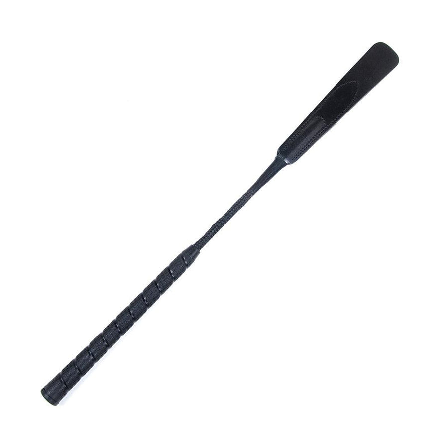 The Motivator Crop from Sportsheets is displayed against a blank background. The crop has a long black handle and rod with a long, rectangular black leather tab at the top.