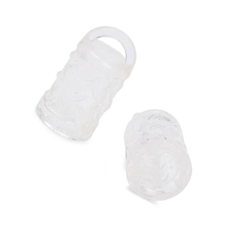 A pair of clear rubber Gripper Nipple Suction cups are displayed against a blank background. They are half-cylinder shaped and are hollow with a small loop at the top.