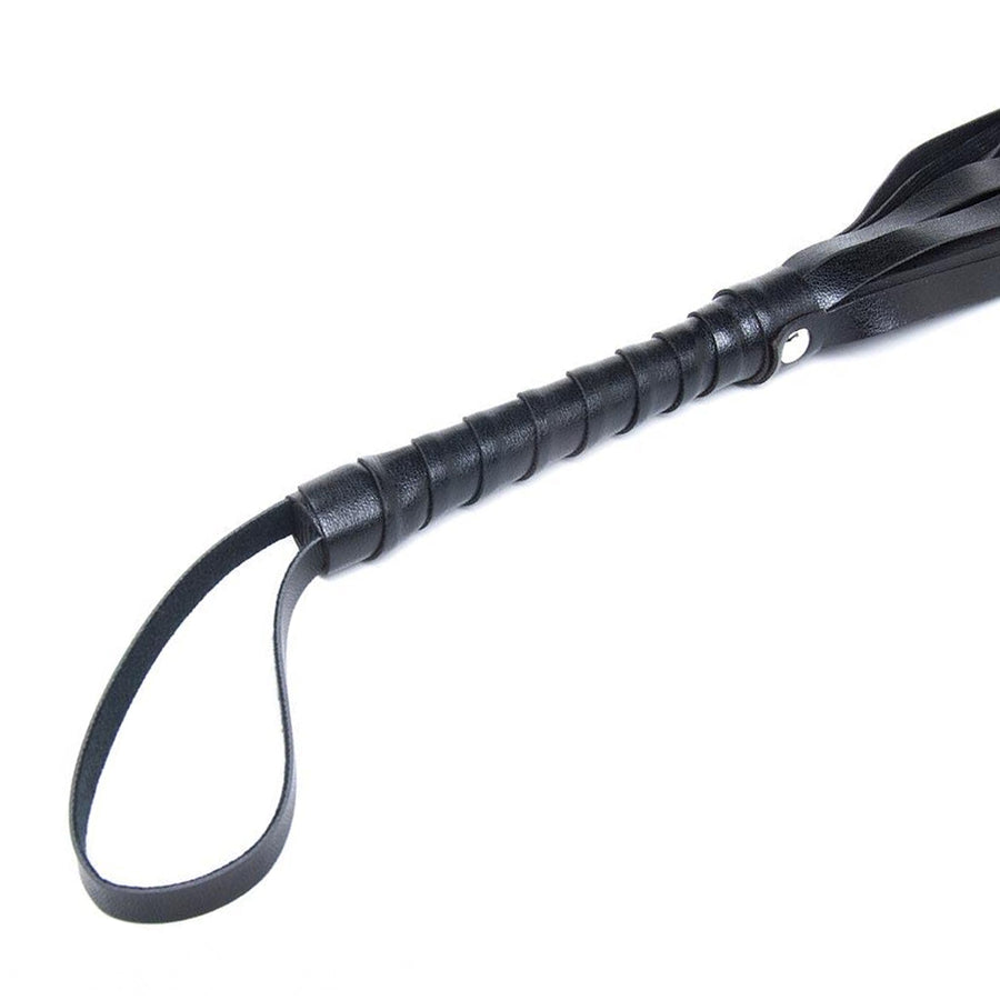 A close-up of the handle of the black S&M Mini Flogger from Sportsheets is displayed against a blank background.