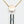 Load image into Gallery viewer, The bottom of the Vesper Pendant Necklace Vibrator is shown below a rose gold chain, which has a pendant with the Crave logo on it. The vibrator has one small button.
