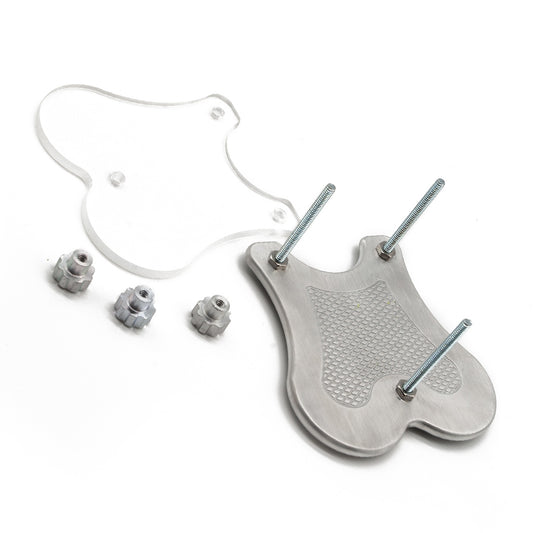 A disassembled Extreme CBT Ball Crusher is shown against a blank background. There is a metal bottom plate with three bolts is shown next to a clear acrylic top plate. The three nuts for the bolts are next to the plates.