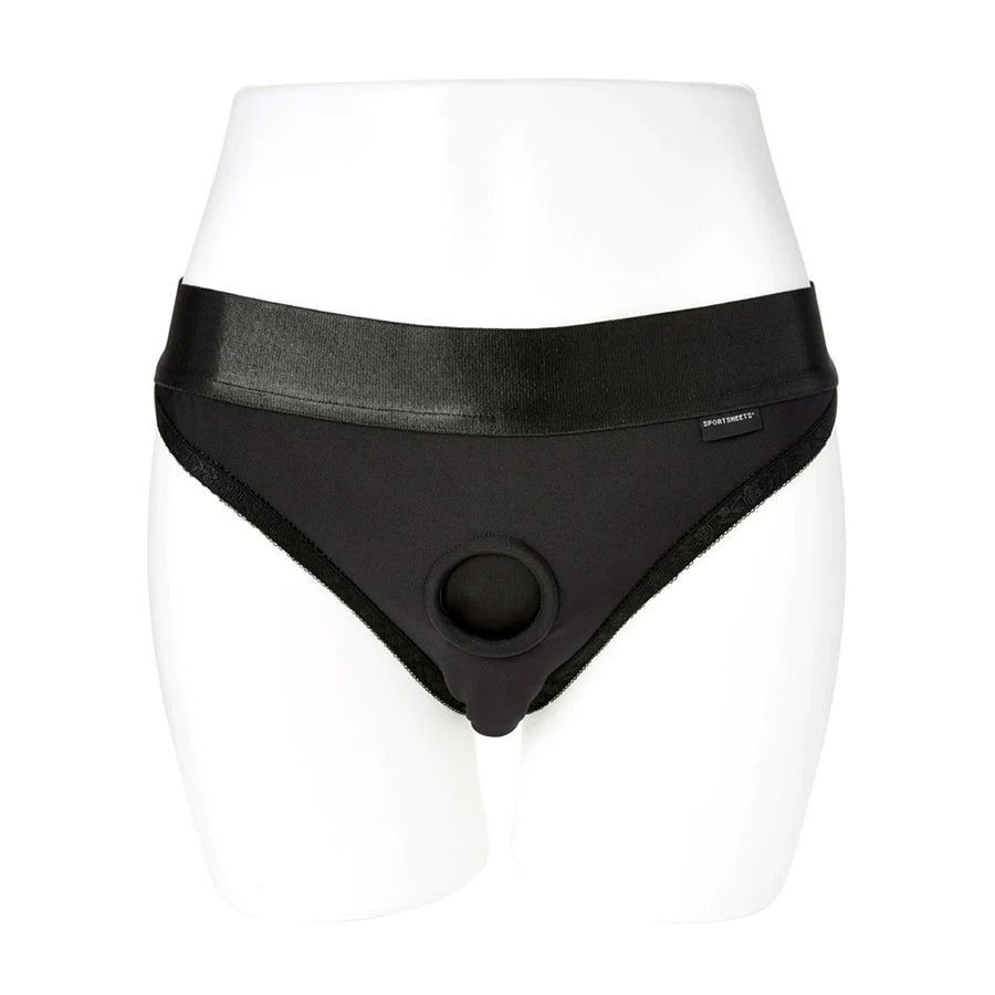 The Em.Ex. Silhouette Crotchless Strapon Harness is displayed from the front on the lower half of a mannequin against a blank background. The harness is made of black cloth and is underwear style with a thick waist band.