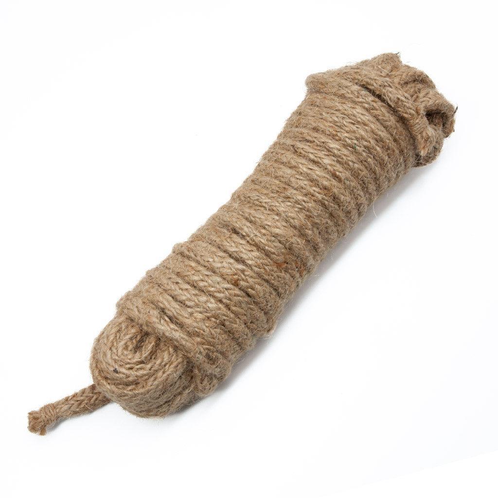 A coil of brown hemp rope on a white background. 